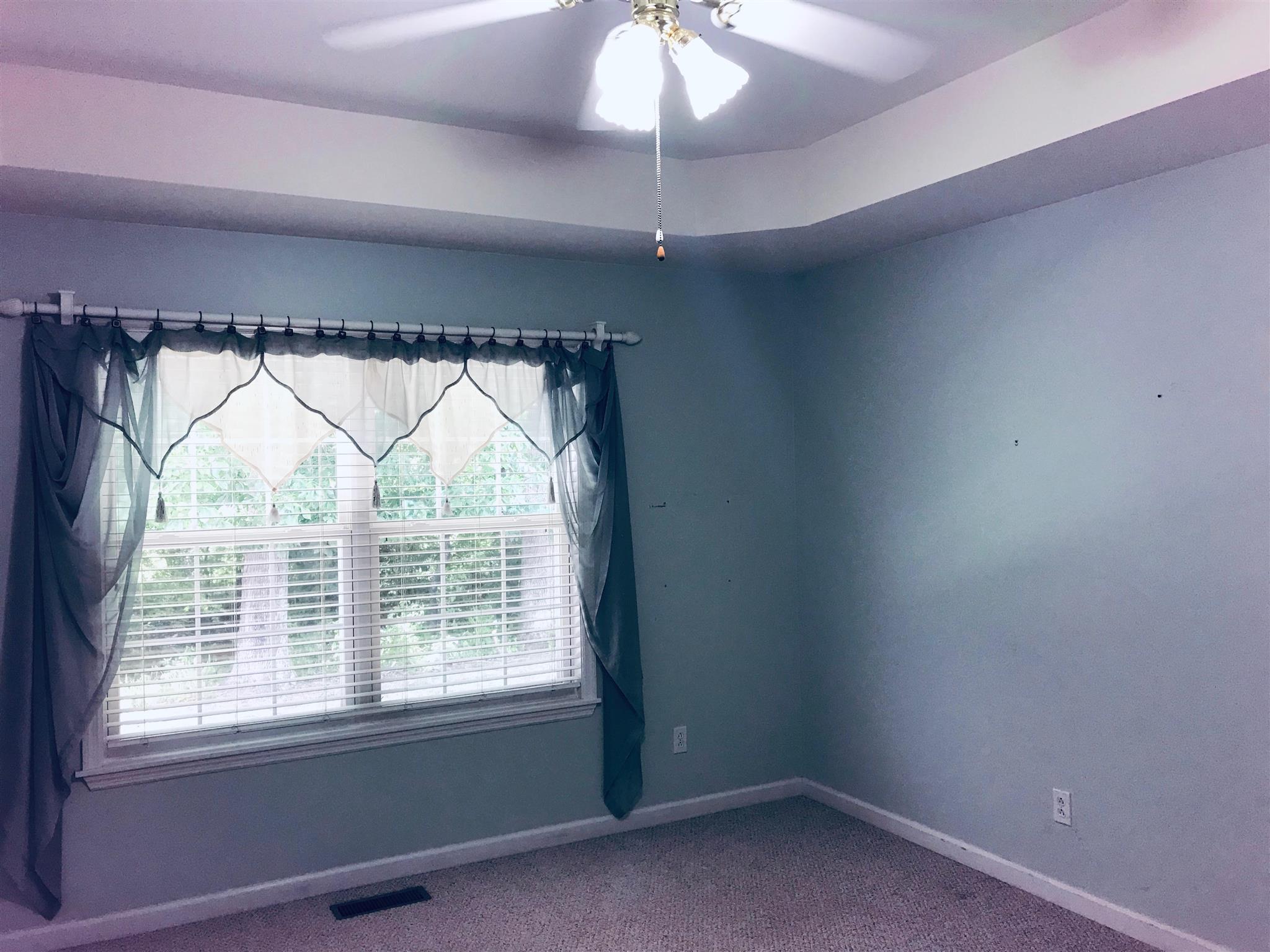 349 Duck River Road Manchester, TN 37355 - Photo 16 of 18 a view of a room that has a window and a fan