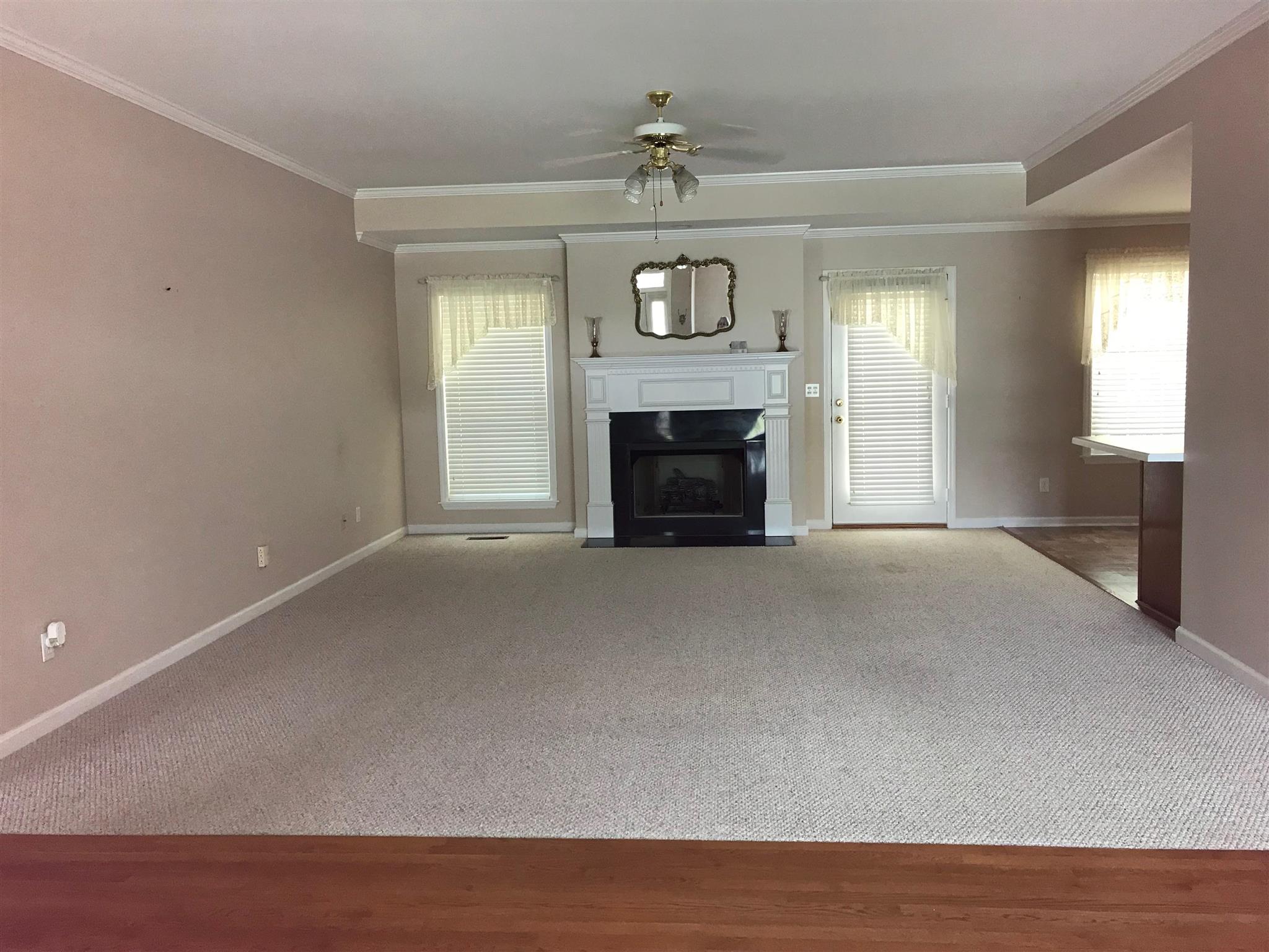 349 Duck River Road Manchester, TN 37355 - Photo 18 of 18 a view of an empty room with a fireplace and a window