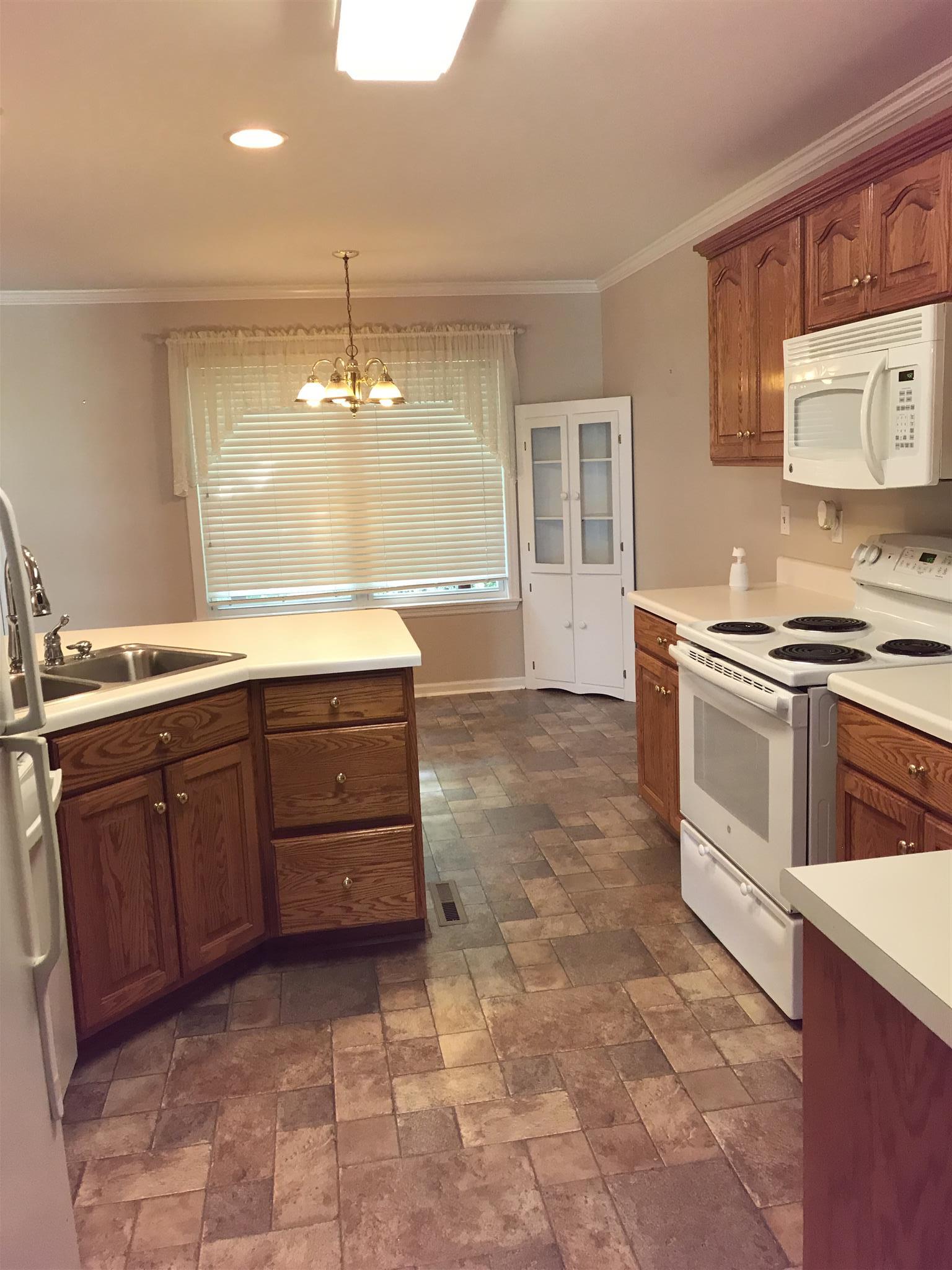 349 Duck River Road Manchester, TN 37355 - Photo 4 of 18 a kitchen with a sink and cabinets