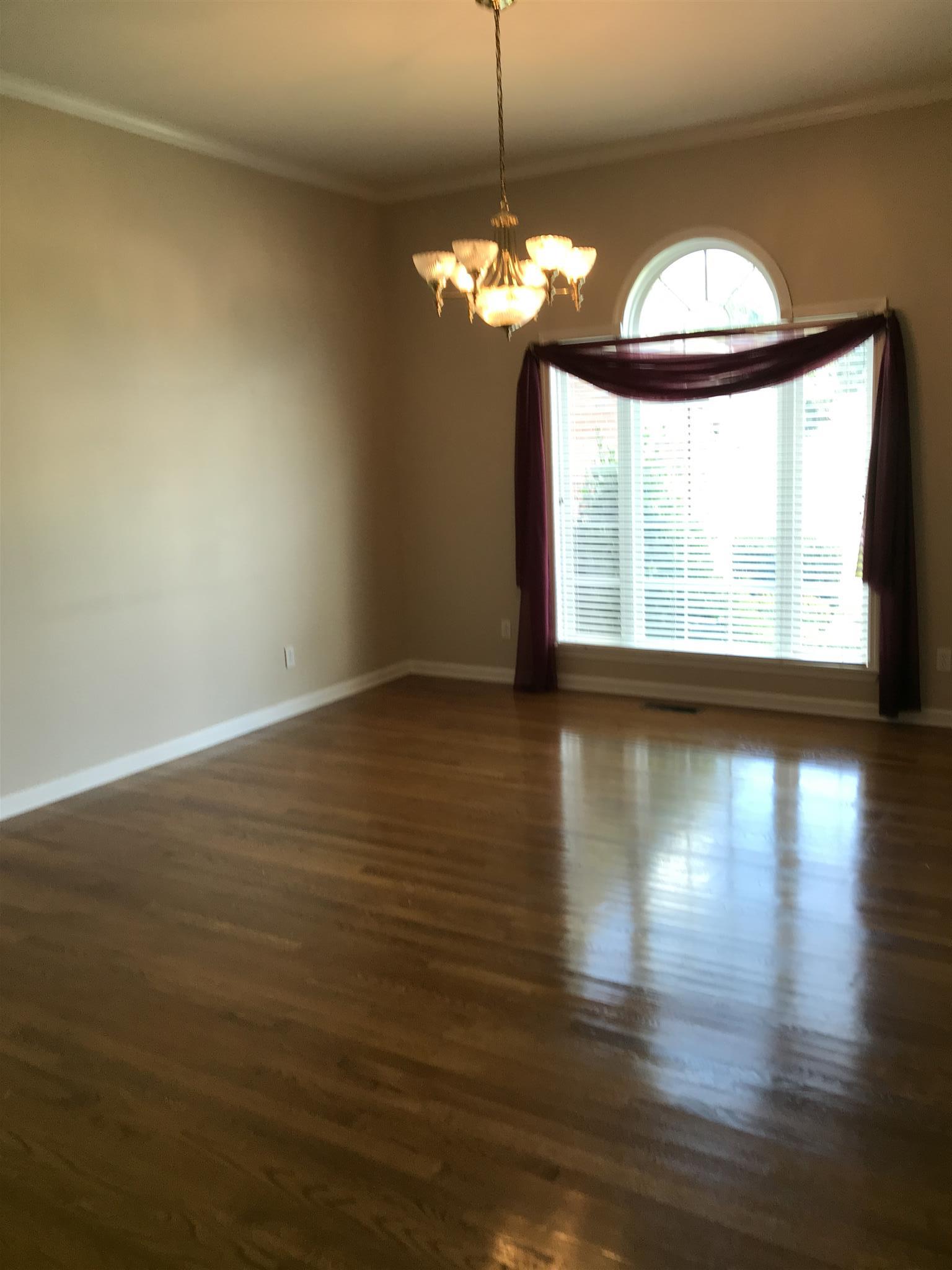 349 Duck River Road Manchester, TN 37355 - Photo 6 of 18 a view of a livingroom with wooden floor and a large window