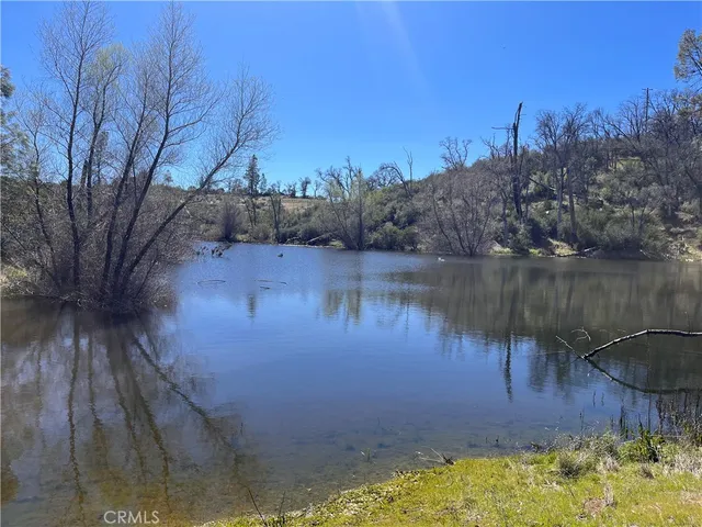 a view of a lake with a yard