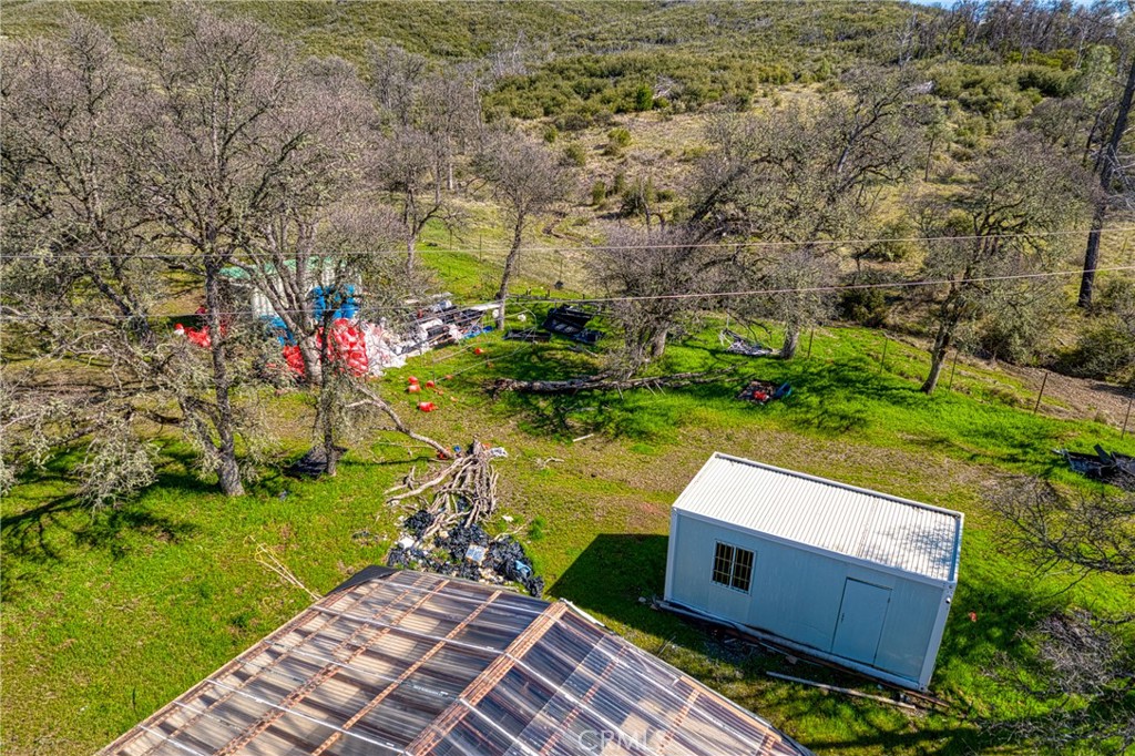 23523 Morgan Valley Road Lower Lake, CA 95457 - Photo 34 of 45 a view of a wooden house with a yard