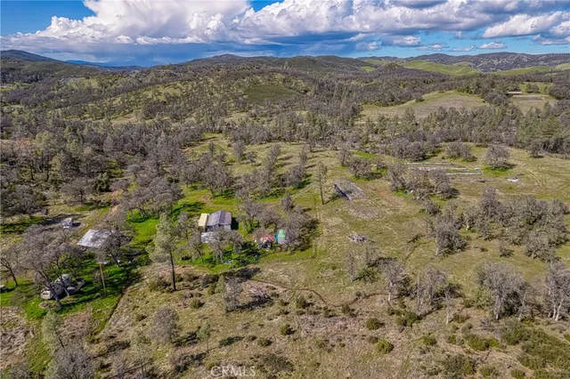a view of a yard with iron fence
