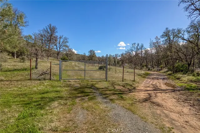 a view of dirt yard and mountain