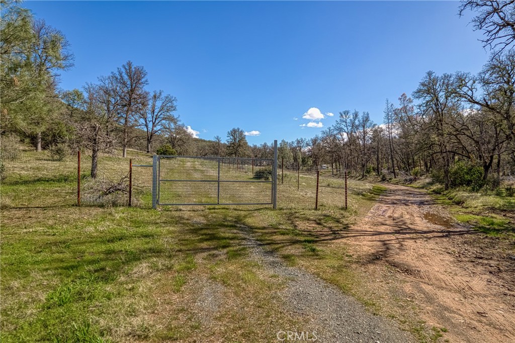23523 Morgan Valley Road Lower Lake, CA 95457 - Photo 40 of 45 a view of a yard with iron fence