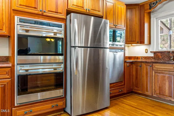a utility room with sink dryer and washer