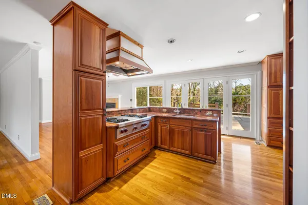 a room with pool table and glass windows