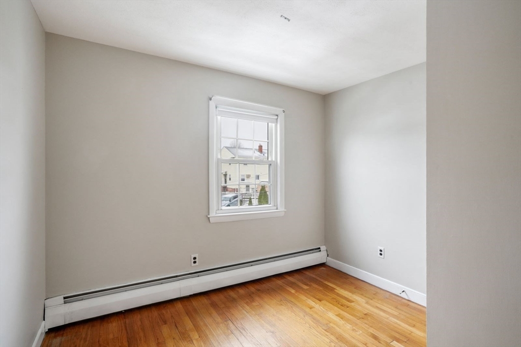 10-12 Norcross Circle Arlington, MA 02474 - Photo 16 of 31 an empty room with window