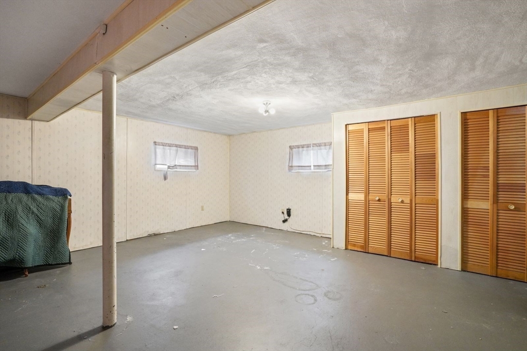 10-12 Norcross Circle Arlington, MA 02474 - Photo 18 of 31 a view of an empty room with a window