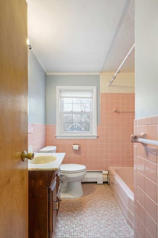 10-12 Norcross Circle Arlington, MA 02474 - Photo 20 of 31 a bathroom with a sink toilet and shower