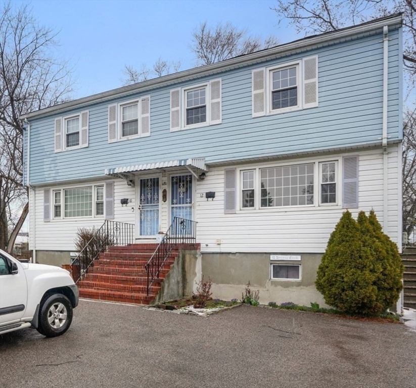 10-12 Norcross Circle Arlington, MA 02474 - Photo 3 of 31 a car parked in front of a house
