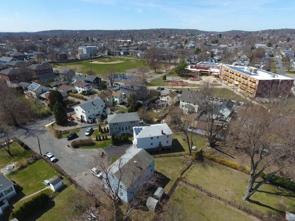 10-12 Norcross Circle Arlington, MA 02474 - Photo 5 of 31 an aerial view of a city with lots of residential buildings