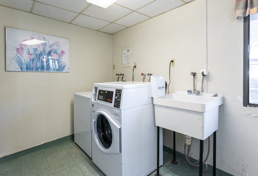9 Broadway, Unit 223 Saugus, MA 01906 - Photo 15 of 18 a utility room with dryer and washer
