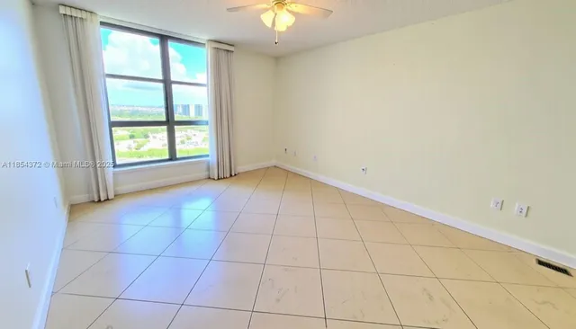 a view of an empty room and window in a room