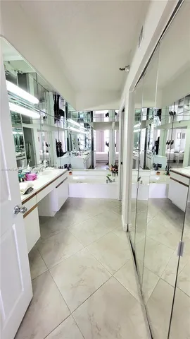 a living room with furniture and a book shelf