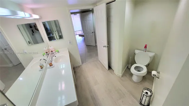 a bedroom with a bed and a mirror