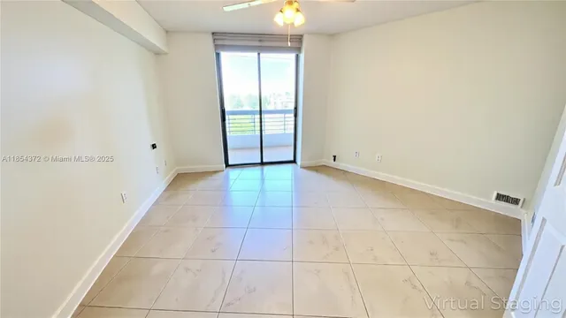 a living room with furniture and a gym equipment