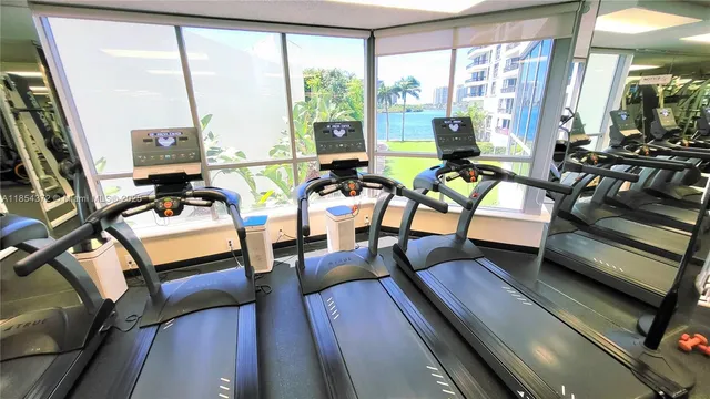 a view of a livingroom with furniture and bookshelf