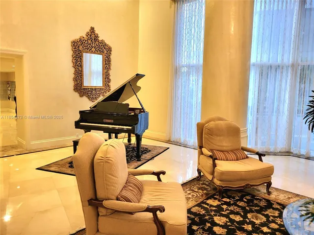 a view of a living room with a sink and chandelier