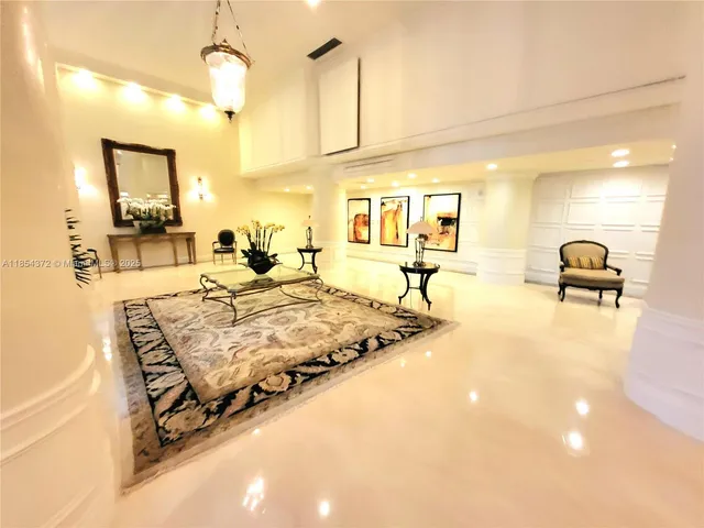 a view of a lake with a fountain in front of it