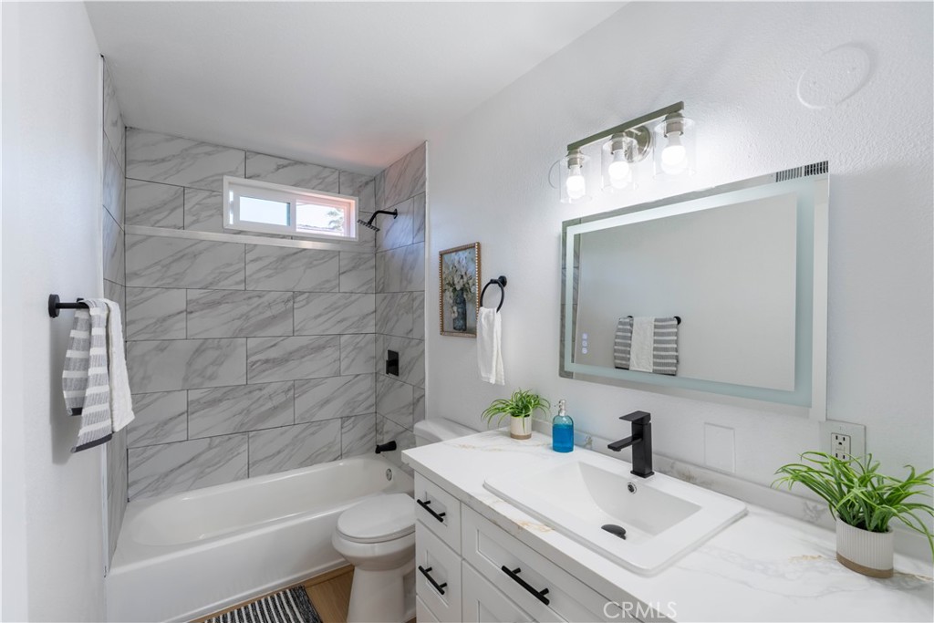 4065 Madrona Road Riverside, CA 92504 - Photo 16 of 35 a bathroom with a sink toilet and shower