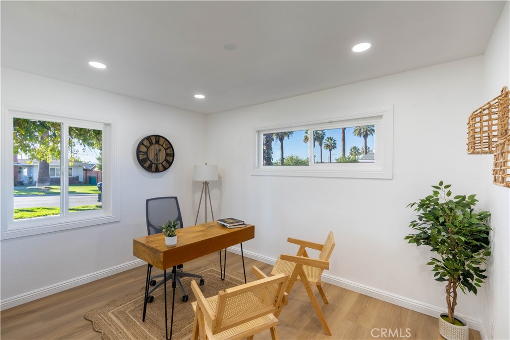 4065 Madrona Road Riverside, CA 92504 - Photo 17 of 35 a view of a dining room with furniture and a potted plant