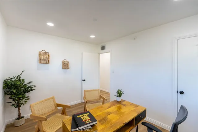 a view of a workspace with furniture