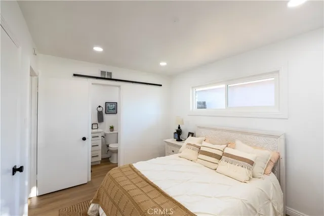 a bedroom with a bed and a walk in closet