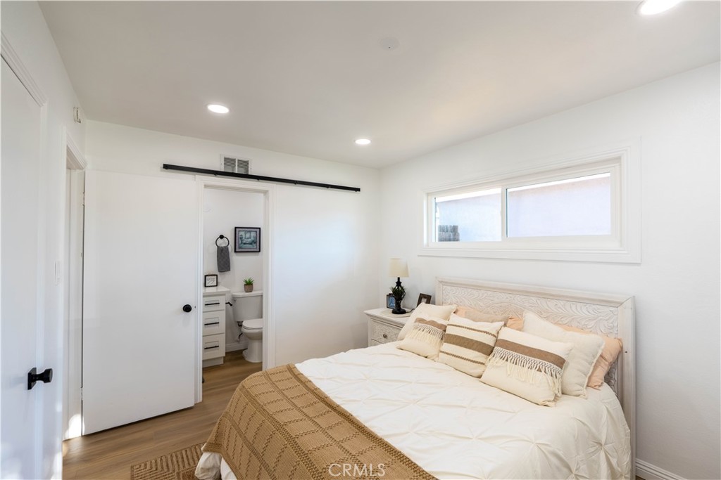 4065 Madrona Road Riverside, CA 92504 - Photo 19 of 35 a bedroom with a bed and a walk in closet