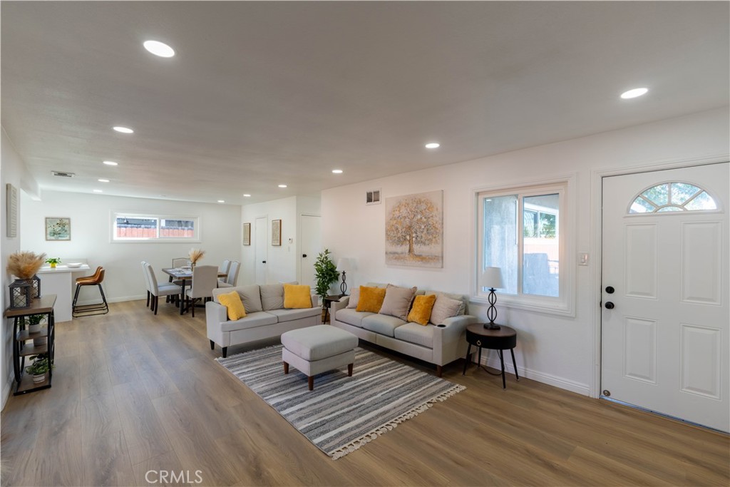 4065 Madrona Road Riverside, CA 92504 - Photo 4 of 35 a living room with furniture and wooden floor
