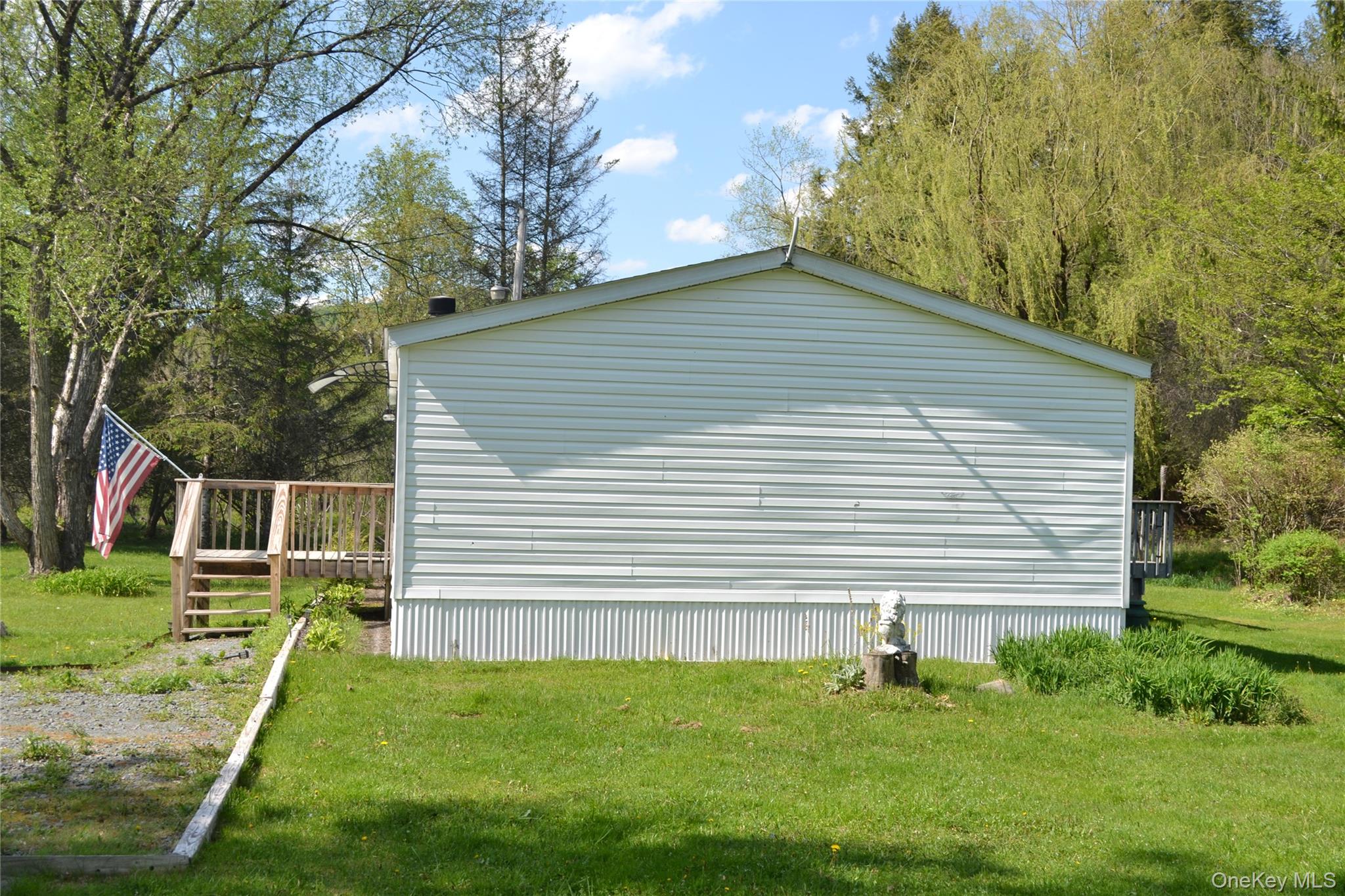 144 Bonnie Brook Road Roscoe, NY 12776 - Photo 4 of 34 a front view of a house with a yard