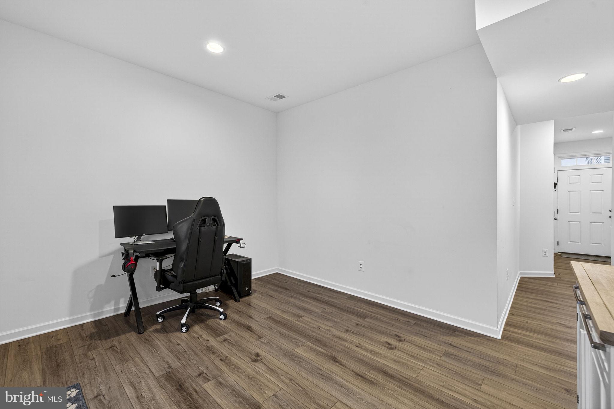 101 Union Ridge Drive Charles Town, WV 25414 - Photo 11 of 71 a view of workspace with wooden floor and chair