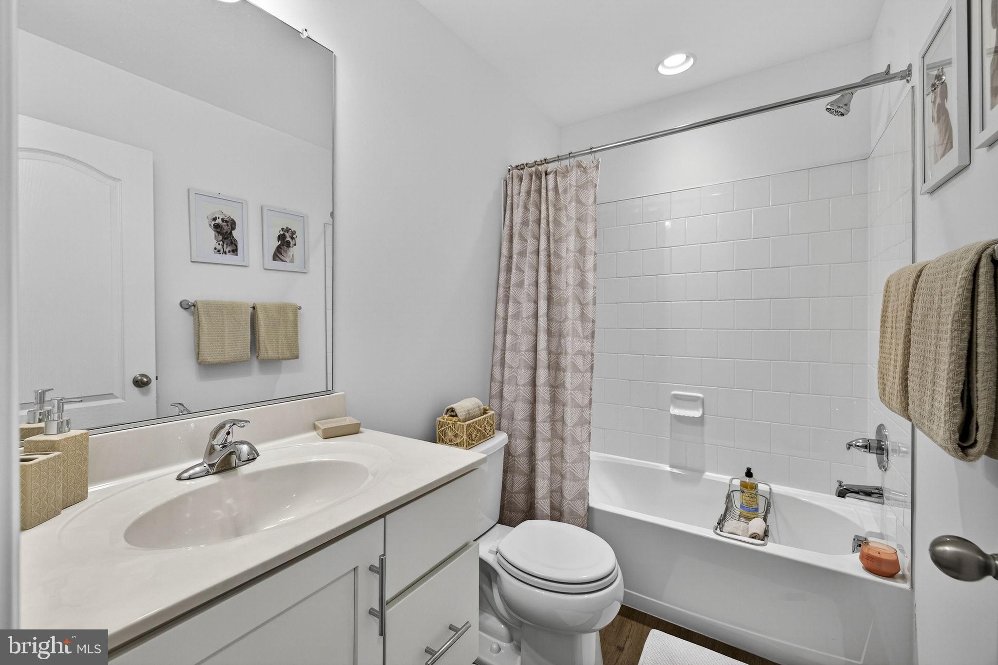 101 Union Ridge Drive Charles Town, WV 25414 - Photo 35 of 71 a bathroom with a sink toilet a mirror and shower