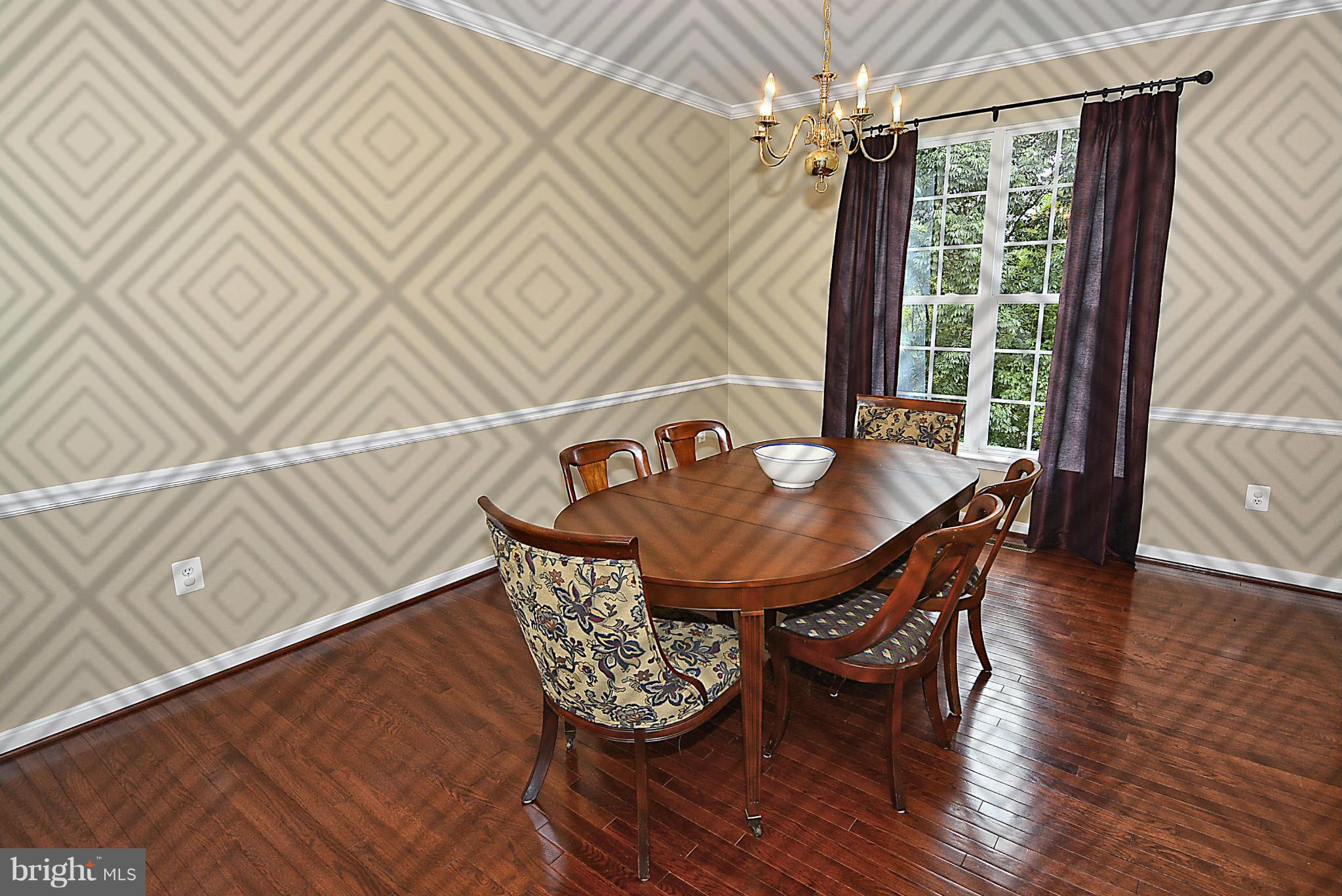 1702 Crommelins Court Point of Rocks, MD 21777 - Photo 4 of 12 a dining room with furniture and wooden floor