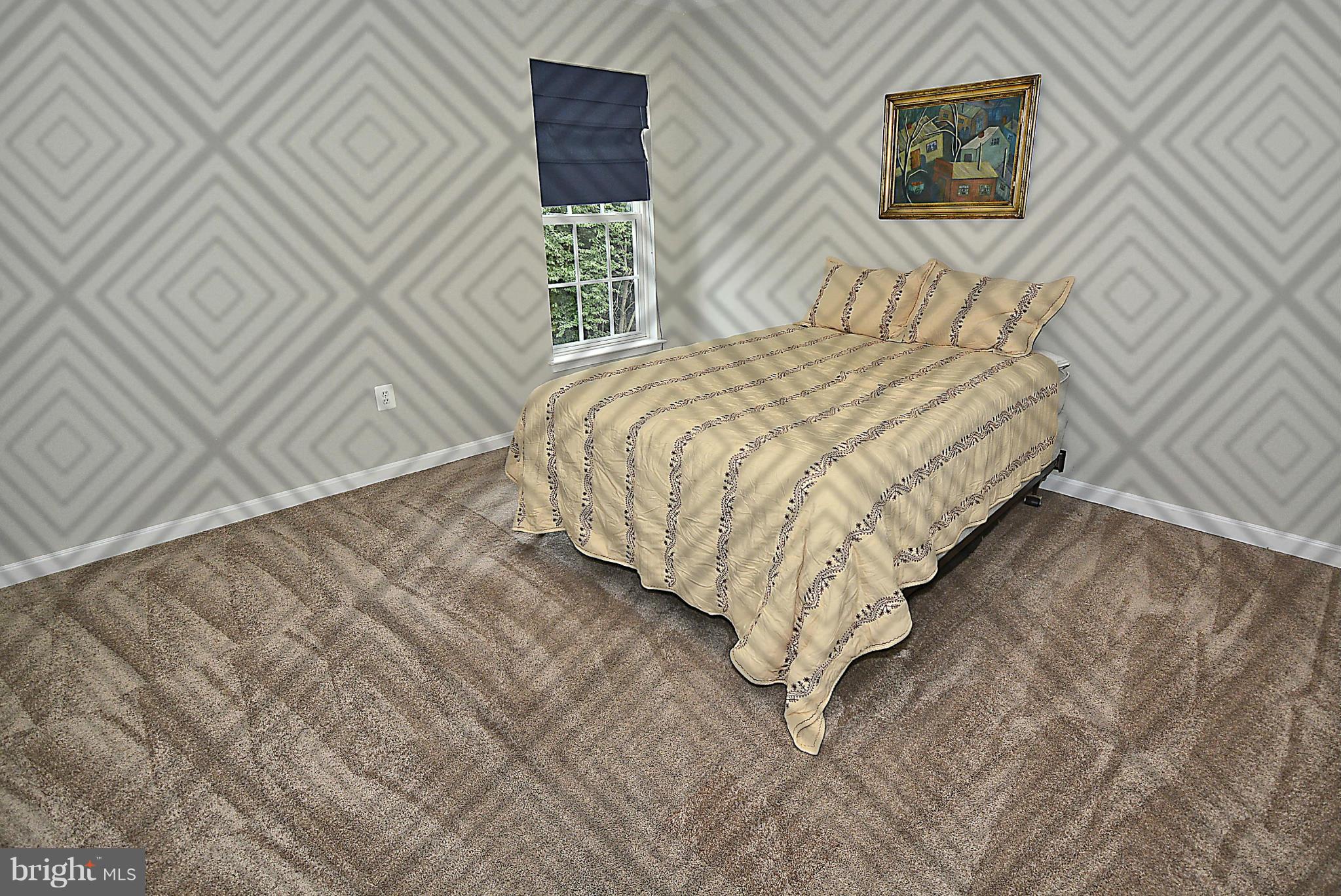 1702 Crommelins Court Point of Rocks, MD 21777 - Photo 10 of 12 a bedroom with a bed and a painting on the wall