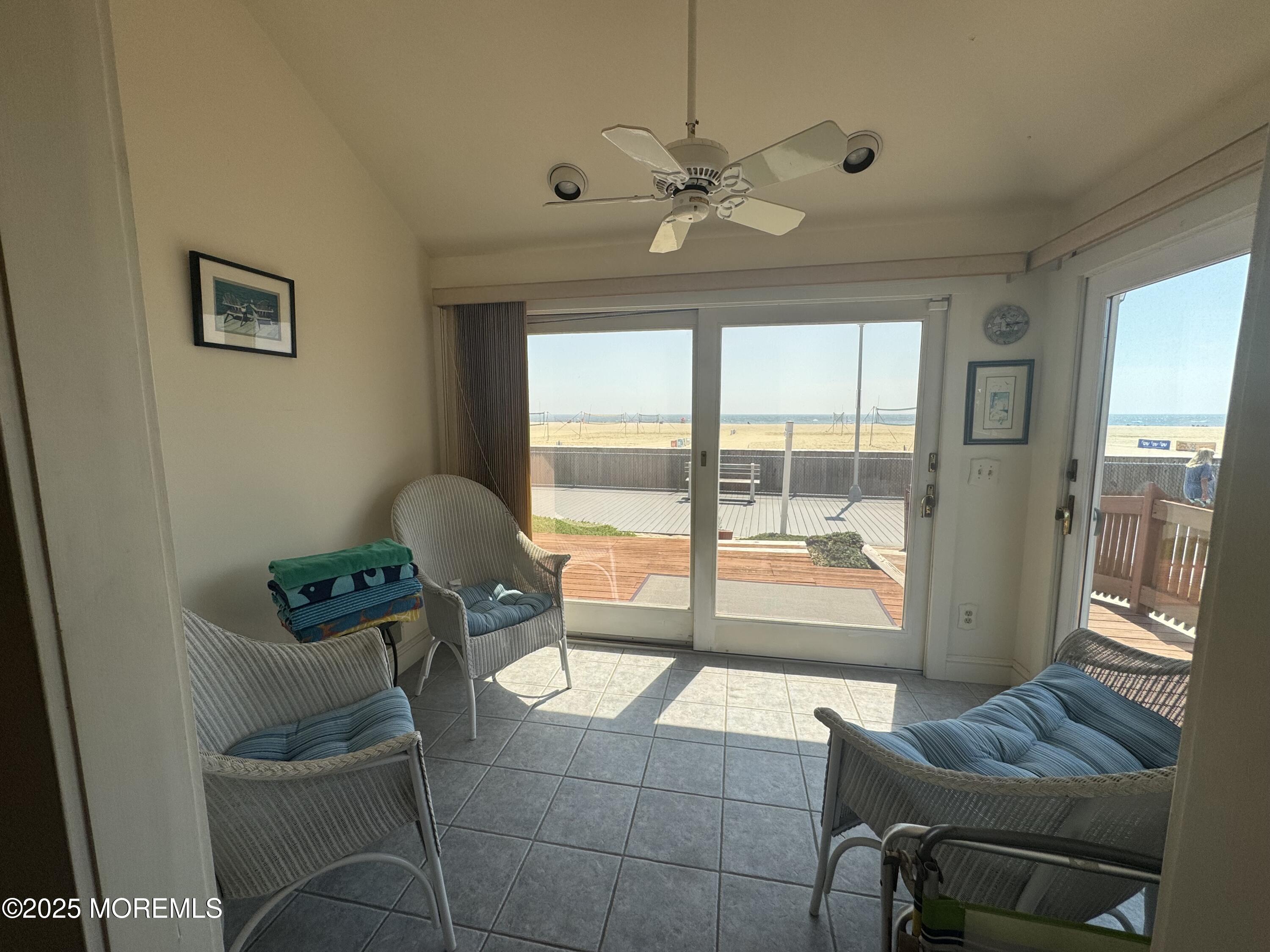 115 Boardwalk Point Pleasant Beach, NJ 08742 - Photo 19 of 23 a living room with furniture and a large window