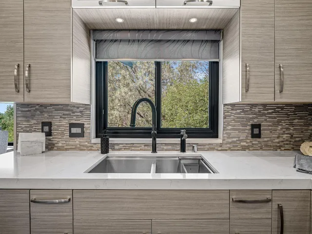 a kitchen with a stove and a sink