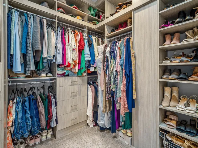 a living room with furniture gym equipment and a large window