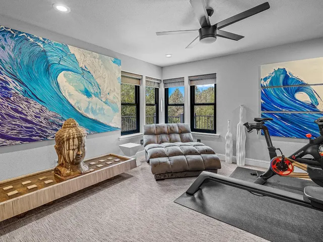 a living room with furniture gym equipment and a view of living room