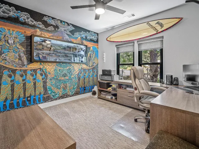 a bedroom with bed and a window