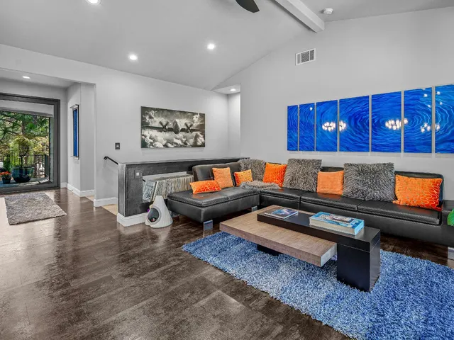 a living room with furniture and a rug