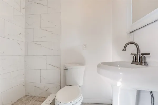 a bedroom with a bed and ceiling fan