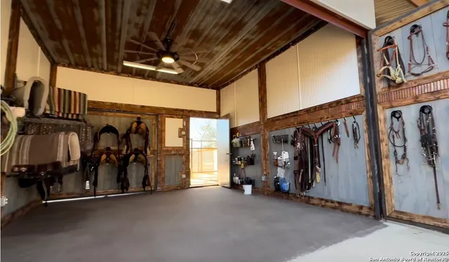 a view of a porch with a chairs and plants