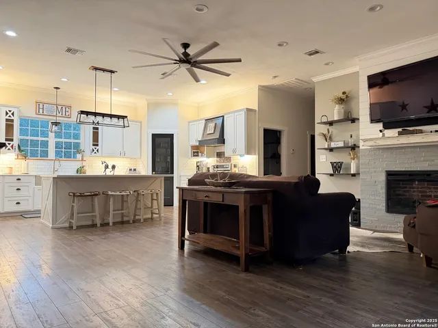 a living room with furniture and flat screen tv
