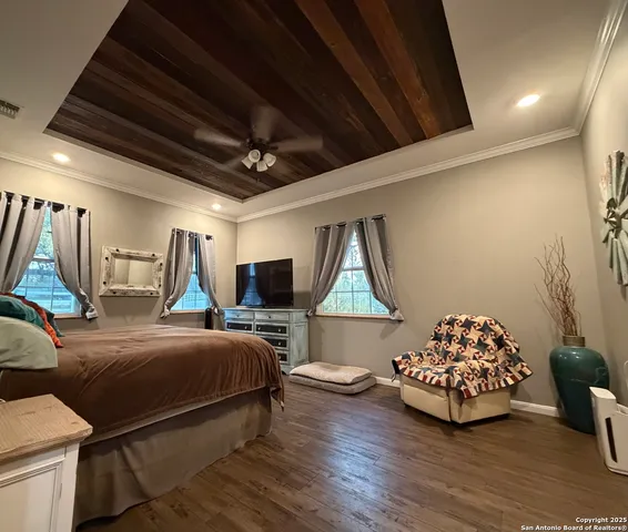 a bedroom with bed and a chair