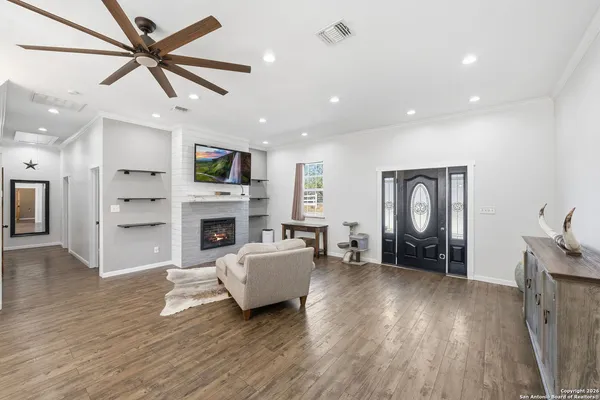 a living room with furniture and a fireplace