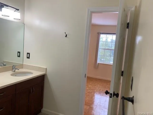 a bathroom with a sink and a mirror