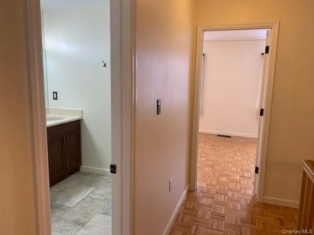 a view of a bathroom from a hallway