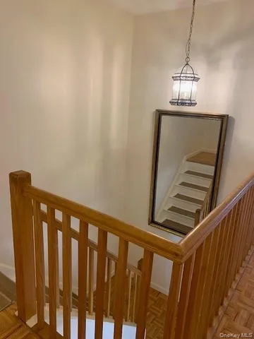 a view of a hallway with stairs
