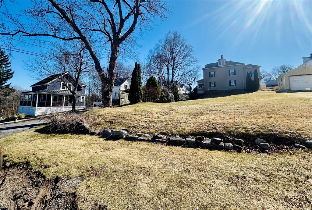 5 Richman Street Clinton, MA 01510 - Photo 2 of 4 a view of a house with snow yard